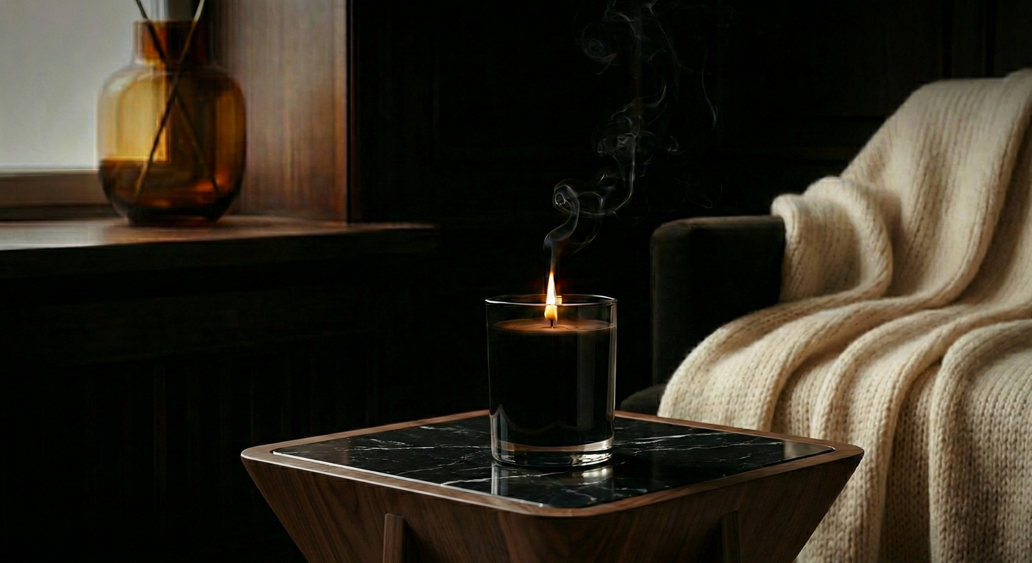 Sogor atelier luxury scented candle on a dark wood table minimalist decor
